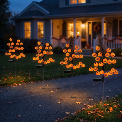 Row of solar pumpkin branch lights lining a driveway