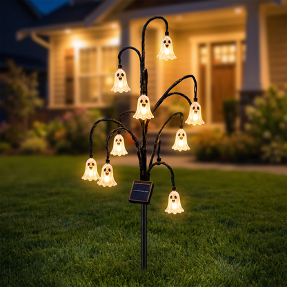 Ghost Branch Lamp Warm 12L Round on a front lawn at night