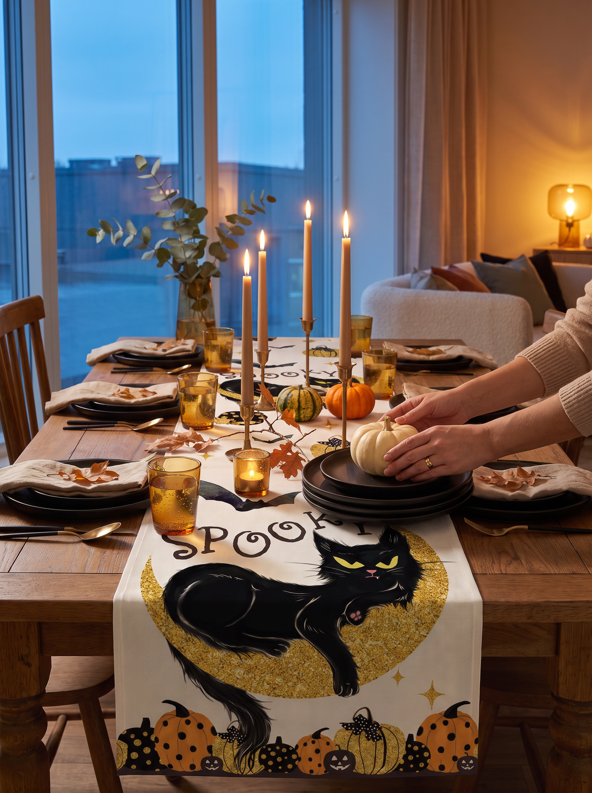 Pumpkin and ghost linen table runner on a dinner table